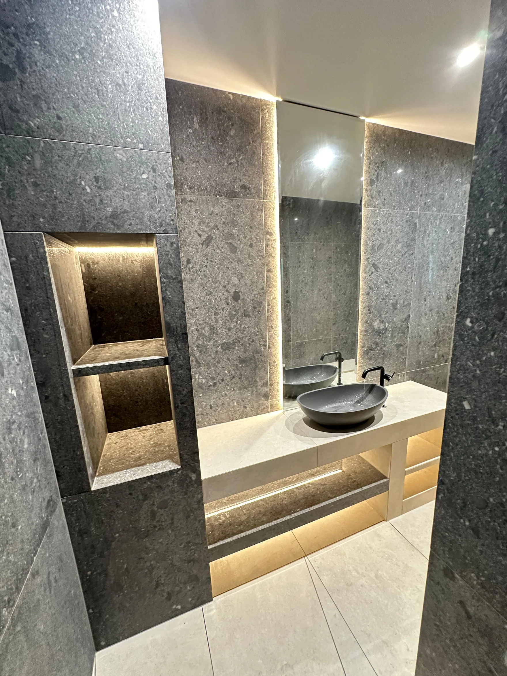 Recessed shower shelves and integrated lighting